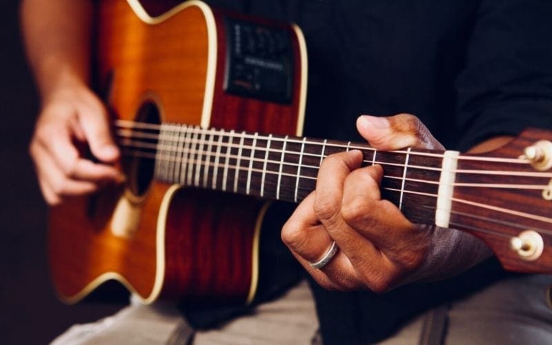 man playing guitar 