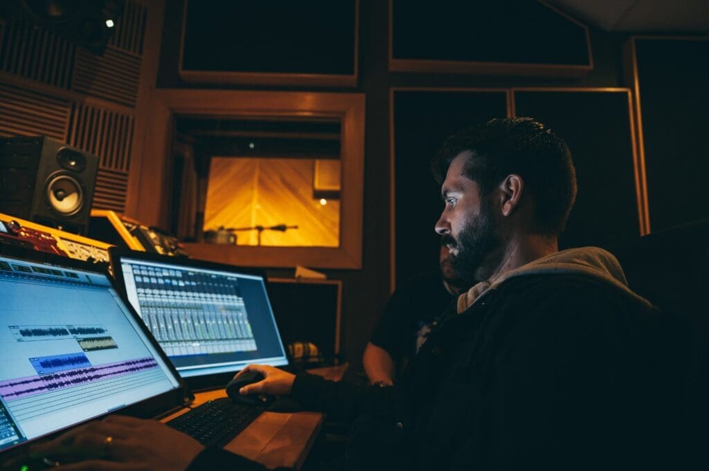 Producer works at is digital workstation creating music